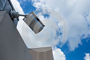 Security camera on blue sky