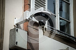 security camera on building facade in the street