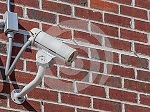 Security camera, CCTV on brick wall background