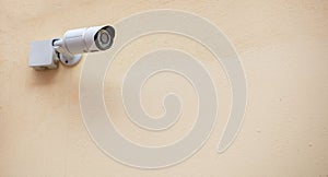 Security Camera CCTV isolated on beige color wall background