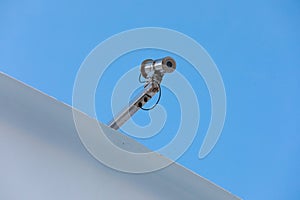 security camera on cruise ship against blue background