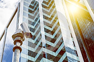 Security camera with modern office buildings in the background