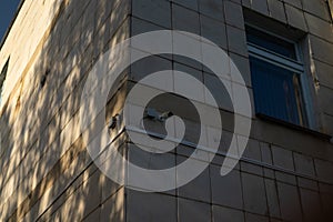 Security camera mounted on a building