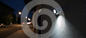 Security camera observes building wall during nighttime hours