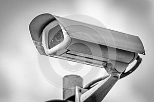 Security camera with sly in background.