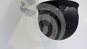 Security camera on white wall