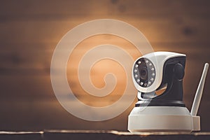 Security camera on Wood table. IP Camera
