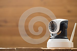 Security camera on Wood table. IP Camera