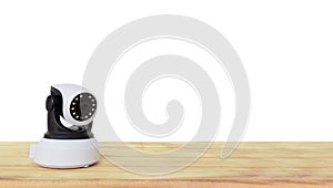 Security camera on Wood table. IP Camera.