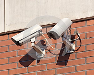 Security cameras on a building wall