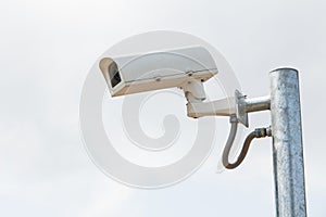 Security cameras or CCTV against sky