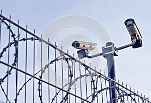 Security cameras over fence