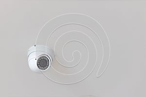Security CCTV camera surveillance system indoor of house. A blurred night Cityscape background. Modern CCTV camera on a wall. Equi photo