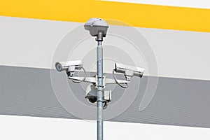 Security cctv cameras on a pole with blue sky background