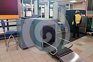 Security checkpoint with scanner machines are scanning luggages. transportation and security technology concept