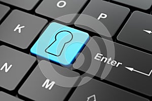 Security concept: Keyhole on computer keyboard background