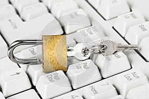 Security concept,open yellow padlock on white keyboard