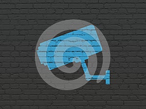 Security concept: Cctv Camera on wall background