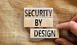 Security by design symbol. Concept words Security by design on wooden blocks on a beautiful canvas table canvas background.