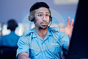 Security dispatch, computer and man with problem, emergency and monitor CCTV, surveillance or crime. Safety officer