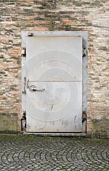 Security door on brick wall