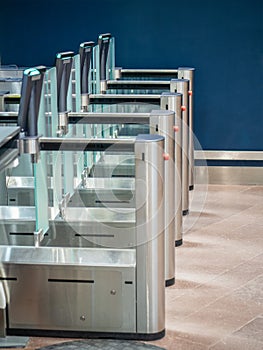 Security gates with metal detectors and scanners at entrance of airport