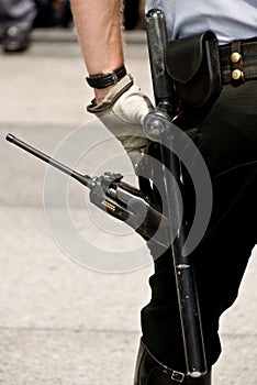 Security gear and officer in watchful stance