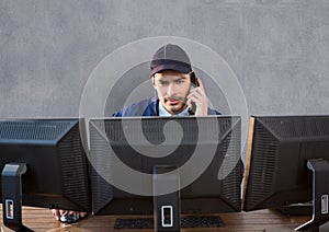 security guard behind the screens phoning