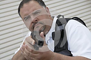 Security Guard In Bulletproof Vest Holding Gun photo