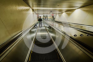 Security guard on escalator at train station