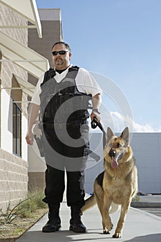 Security Guard With Dog On Patrol