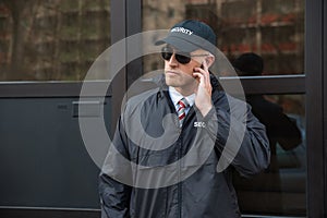 Security Guard In Front Of The Door Entrance