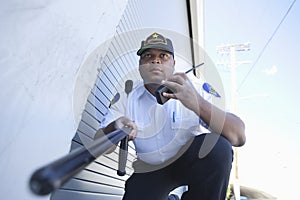 Security Guard Investigates With Walkie Talkie photo