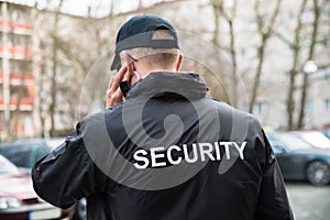 Security Guard Listening With Earpiece