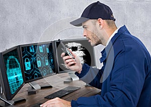 security guard with locks on the screens speaking with the walkie-talkie in his office