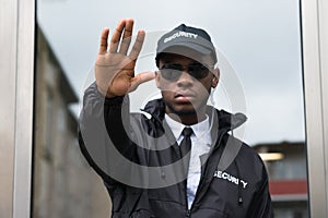 Security Guard Making Stop Gesture photo