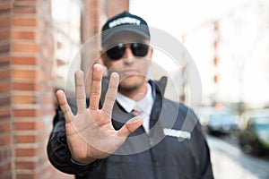 Security Guard Making Stop Sign