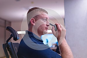 Security guard monitoring modern CCTV cameras in surveillance room.Male security guard in surveillance room. Male security guard