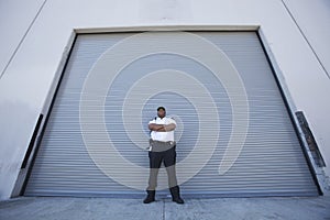 Security Guard Protects Warehouse Entrance