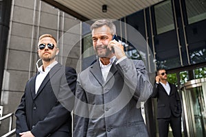 Security Guard Service Protecting Business Man photo