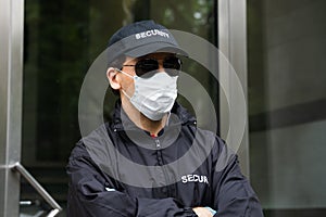 Security Guard Standing In Face Mask