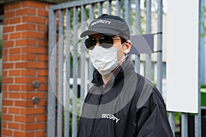 Security Guard Standing In Face Mask