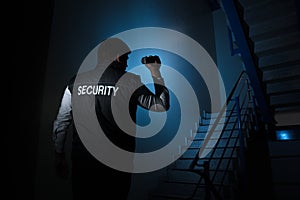 Security Guard Standing Near Stairway