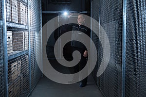 Security Guard Standing In The Warehouse