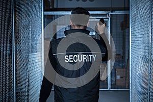 Security Guard Standing In The Warehouse