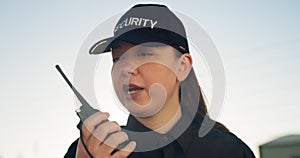 Security guard, talking and outdoor with walkie talkie communication in safety, protection or property surveillance