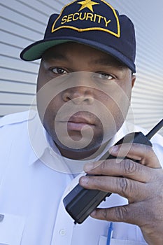 Security Guard Using Walkie Talkie photo