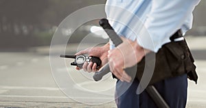 security guard with walkie-talkie in the basket field.