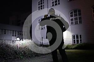 Security Guard Walking Building Perimeter