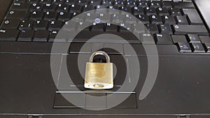 Security lock on black computer keyboard